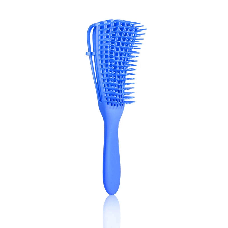 Cepillo Desenredante Profesional | Ideal para cabello rizado, grueso o con nudos. Su diseño flexible tipo “pulpo” masajea el cuero cabelludo, reduce el quiebre y deja tu pelo suave y manejable.